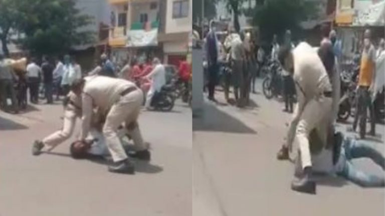 नाक से खिसका मास्क, MP के दो पुलिसकर्मियों ने बीच सड़क पर गिरा कर पीटा: Video वायरल, किए गए सस्पेंड