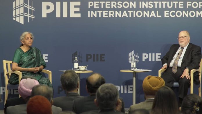 निर्मला सीतारमण और PIIE अध्यक्ष ऐडम